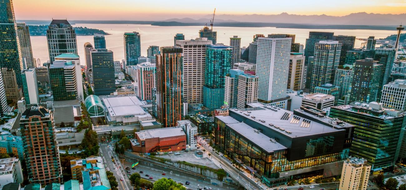 Panorama of both the Arch and Summit buildings with the Seattle Harbor in the background